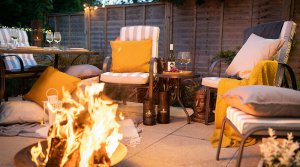 A Shot at night of hadleigh furniture around a firepit